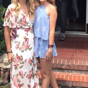 Blue romper on the right